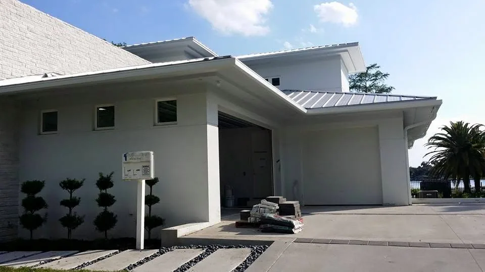 Modern white garage standing seam roof fascia gutter topiary, Sanford